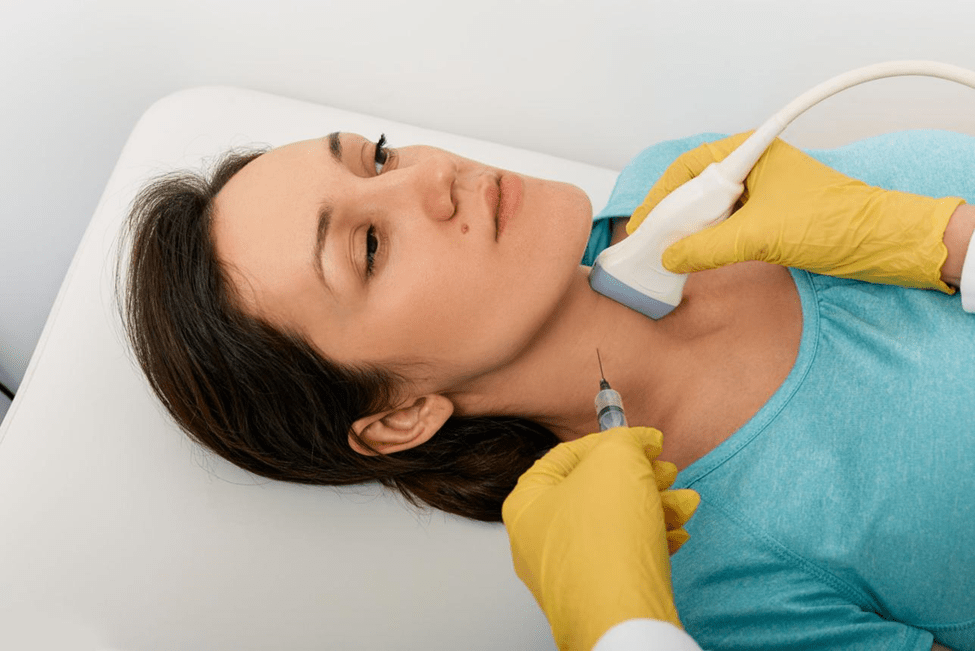 Close-up of thyroid FNAC biopsy site with bandage following post procedure instructions